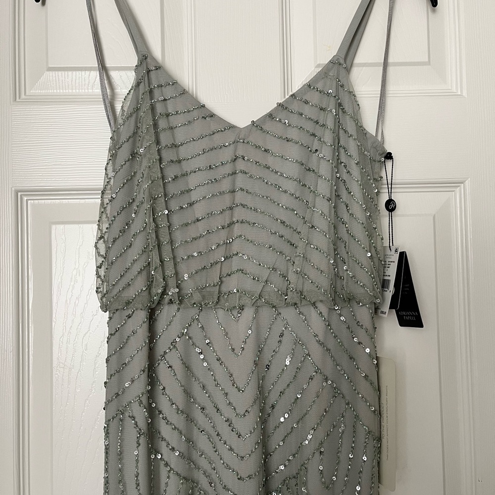 Never worn Adrianna Papell Beaded Gown
Tags attached
Size 6
Color mint - Picture 4 of 7
